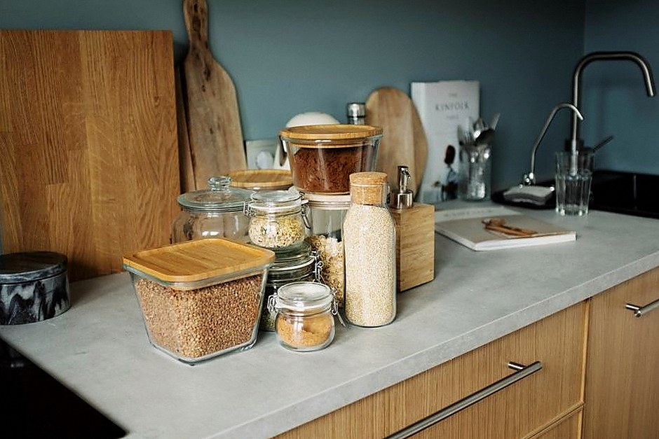 Practical kitchen counter with jars and cutting boards
